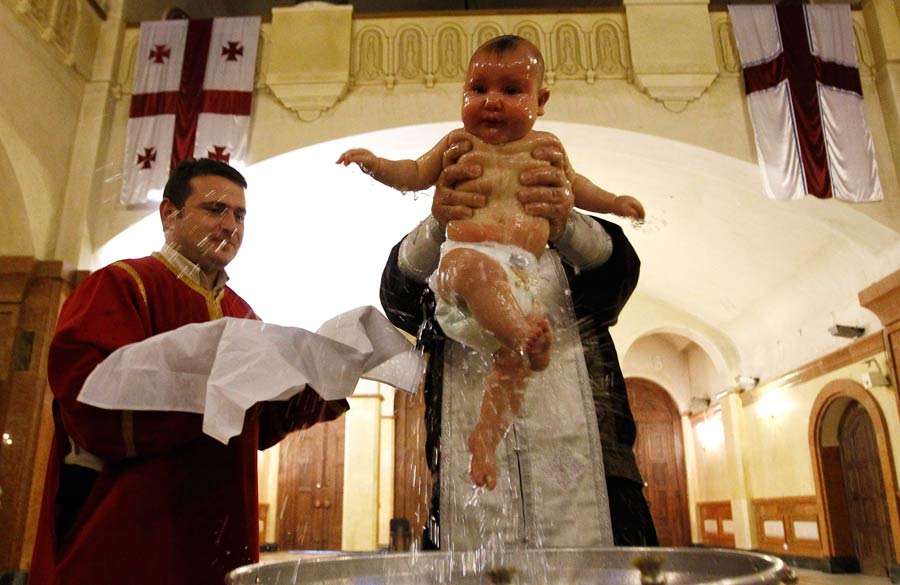 Babies baptized during a mass ceremony