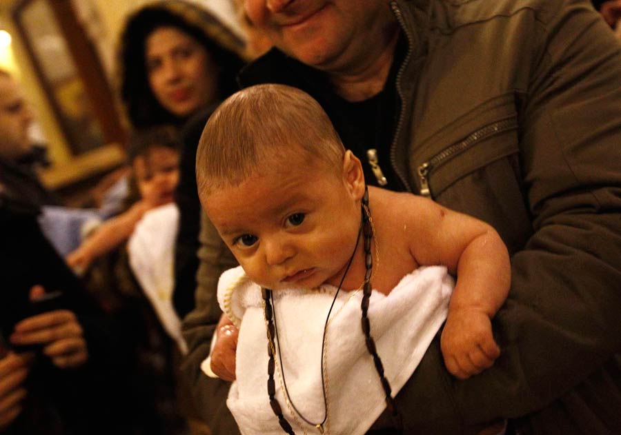 Babies baptized during a mass ceremony