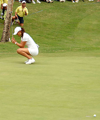 Michelle Wie of Honolulu, Hawaii, reacts as she misses on the 18th hole during Round 2 of the Fields Open at the Ko Olina Golf Club, on the island of Oahu in Kapolei, Hawaii February 24, 2006.
