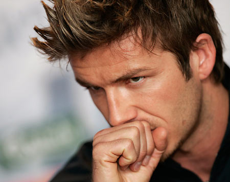 England's captain David Beckham laughs during a news conference at Anfiled in Liverpool, northern England February 28, 2006. England will play Uruguay in an international friendly soccer match at Anfield on Wednesday. [Reuters] 