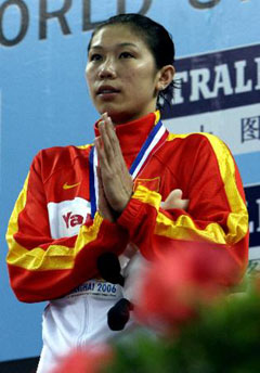 in the women's 400m individual medley event at the 8th FINA World Short Course Swimming Championships in Shanghai April 5, 2006. 