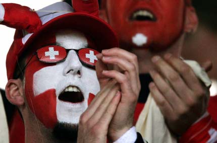 Switzerland soccer fans cheer before the start of the friendly pre-World Cup soccer match between Switzerland and China at the Hardturm stadium in Zurich, June 3, 2006. 