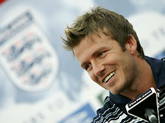England captain David Beckham talks to the media at their World Cup soccer training camp at the Mittelbergstadion near Baden-Baden in Germany June 13, 2006.