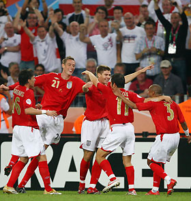 England players celebrate team mate Steven Gerrard's (C) goal against Sweden during their Group B World Cup 2006 soccer match in Cologne June 20, 2006. 