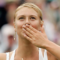 Russia's Maria Sharapova blows kisses to the crowd after defeating Israel's Anna Smashnova at the Wimbledon tennis championships in London June 28, 2006. 