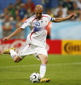 France's Zinedine Zidane shoots from the penalty spot to score against Portugal during their World Cup 2006 semi-final soccer match in Munich July 5, 2006. 