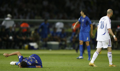 France's Zinedine Zidane (R) walks away after fouling Italy's Marco Materazzi (L) during their World Cup 2006 final soccer match in Berlin July 9, 2006. 