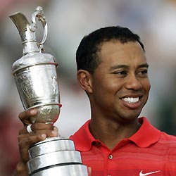 Tiger Woods of the U.S. celebrates with the claret jug trophy after winning the British Open Championship at the Royal Liverpool Golf Club in Hoylake July 23, 2006.