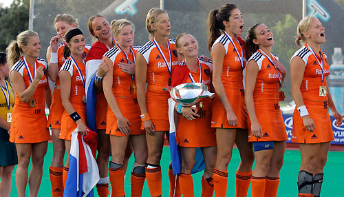 Players of the Netherlands celebrate with the trophy after winning the Women's World Cup field hockey in Madrid October 8, 2006. 