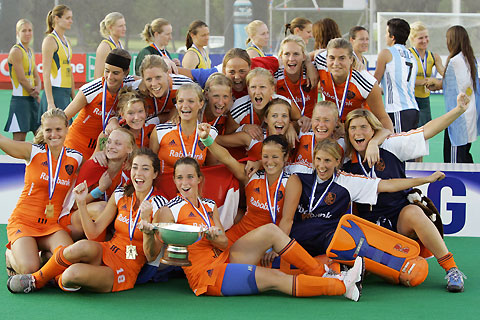 Players of the Netherlands celebrate on the podium after winning the women's field hockey World Cup in Madrid October 8, 2006. 