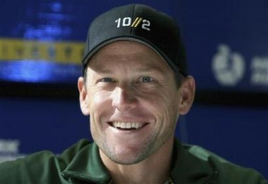 Seven-time Tour De France winner Lance Armstrong smiles as he is introduced to talk about his upcoming running of the New York City Marathon at a news conference in New York November 3, 2006.