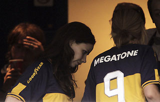 George W. Bush's daughters Barbara (C) and Jenna (R) leave at halftime after watching an Argentine First Division soccer match between Boca Juniors and Colon at La Bombonera stadium in Buenos Aires November 26, 2006. 