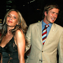 England soccer captain David Beckham (R) and his wife Victoria, attend a party in Singapore in this July 6, 2005 file photo. 