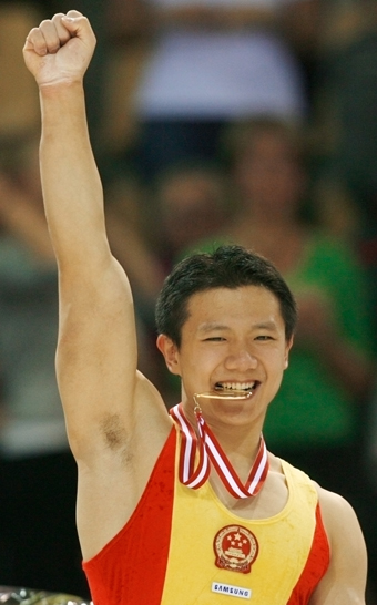 Chinese add three golds to double haul at gymnastics worlds