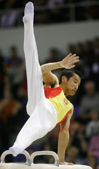 Chinese add three golds to double haul at gymnastics worlds