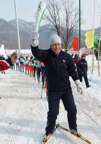 Winter Asiad torch relay on dragon-boat