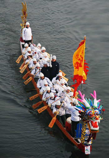 Winter Asiad torch relay on dragon-boat