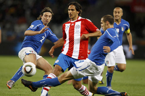 Defending champions Italy held 1-1 tie with Paraguay