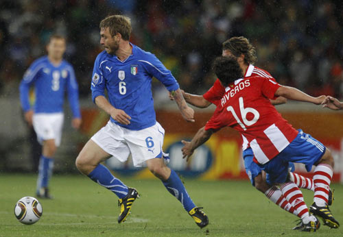 Defending champions Italy held 1-1 tie with Paraguay