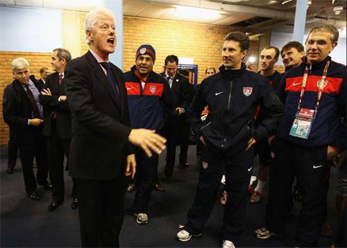 Changing room visitor Clinton praises US spirit