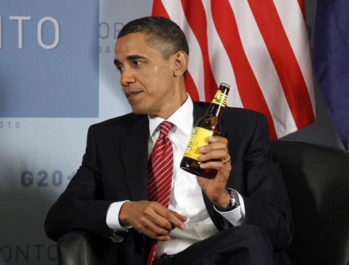 Obama, Cameron pay off World Cup bet with beer