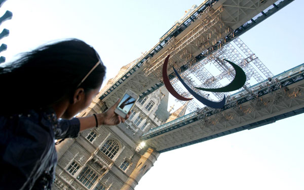 Paralympics logo hangs on Tower Bridge in London