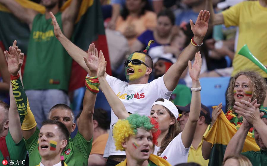 Fans with face paint celebrate Olympics