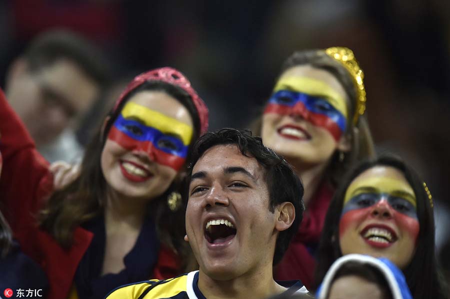 Fans with face paint celebrate Olympics