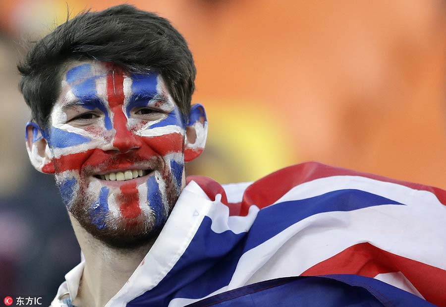 Fans with face paint celebrate Olympics