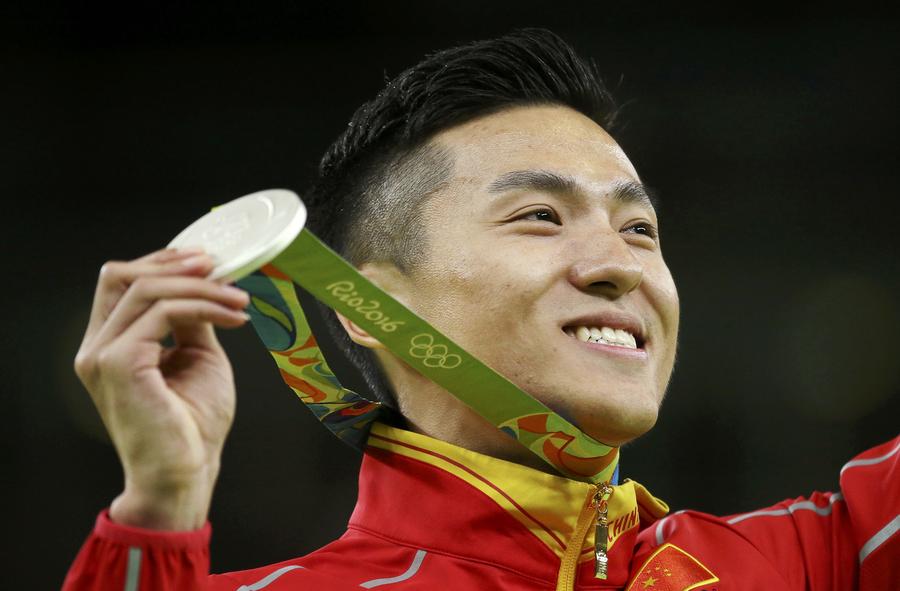 China's Dong and Gao take silver, bronze in men's trampoline