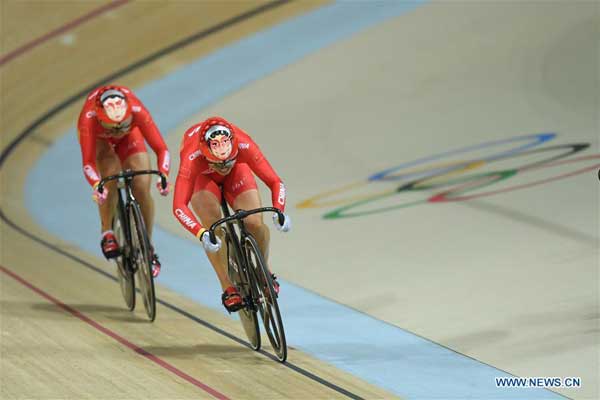 Peking Opera faces spotted on cyclists' helmets in Rio