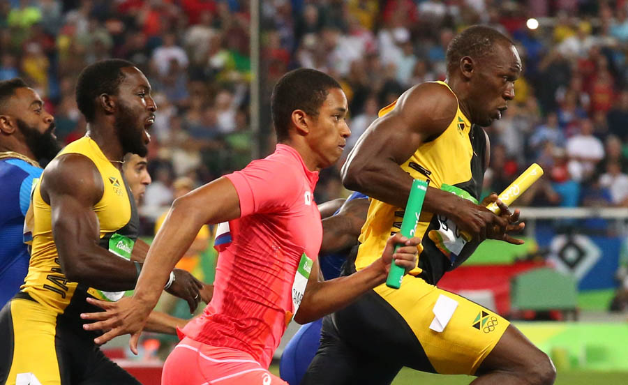 Usain Bolt accomplishes triple hat-trick