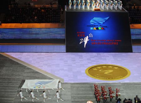 The flag of 24th World Winter Universiade is escorted into Harbin International Conference, Exhibition and Sports Centre Gym at the opening ceremony of the 24th World Winter Universiade in Harbin, capital of northeast China&apos;s Heilongjiang Province, Feb.18, 2009. (Xinhua/Guo Dayue