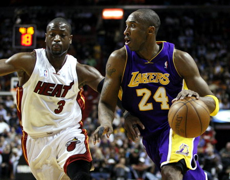 Kobe shines before Heat stifles Lakers in overtime