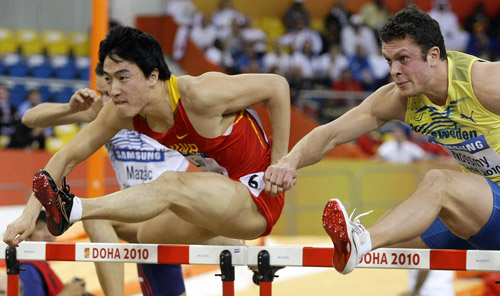 Liu Xiang competes in hurdles heats in Doha