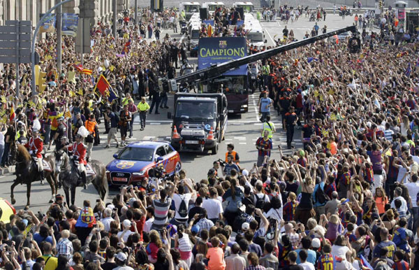 Barcelona savours sun-kissed trophy parade