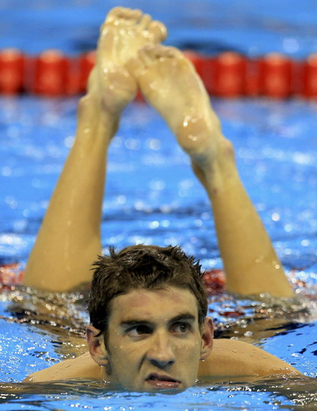 Phelps takes 3rd gold at swim worlds in 100 fly