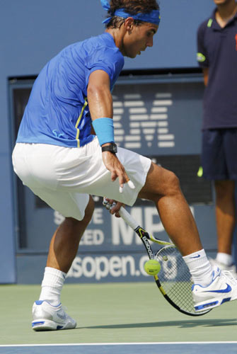 Nadal wins again but felled by cramps at US Open