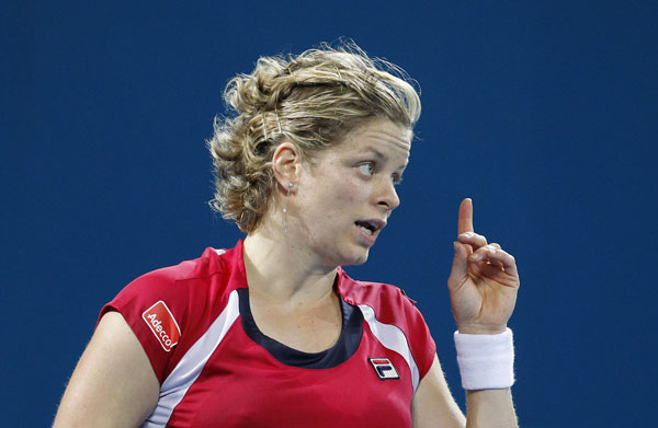 Clijsters eases into semis, Kanepi upsets Petkovic