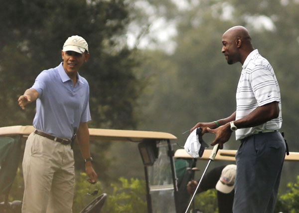 Obama plays golf with NBA player