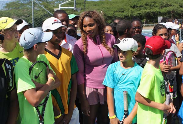 Williams sisters, Olympic sprinters join in tennis clinic