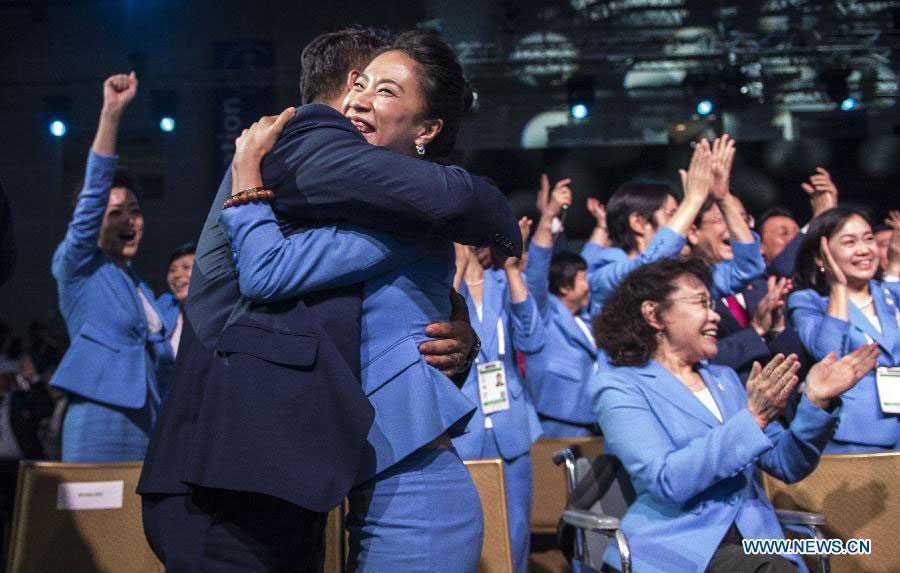 Chinese celebrate Beijing's win