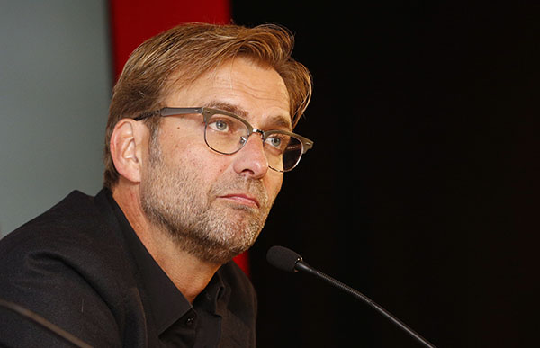 'Normal One' Klopp wins over fans and legends