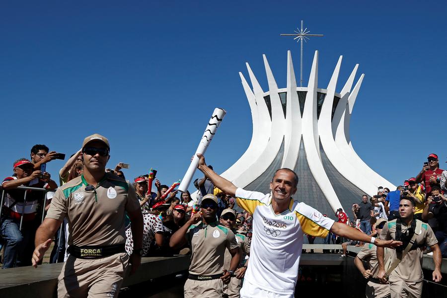 Olympic flame lands in Brazil for 94-day relay to Games