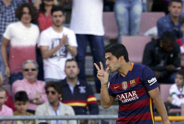 Suarez savors hat-trick as Barca take La Liga crown