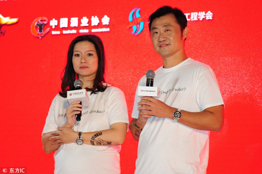 Pregnant Li Na and husband attend public benefit event