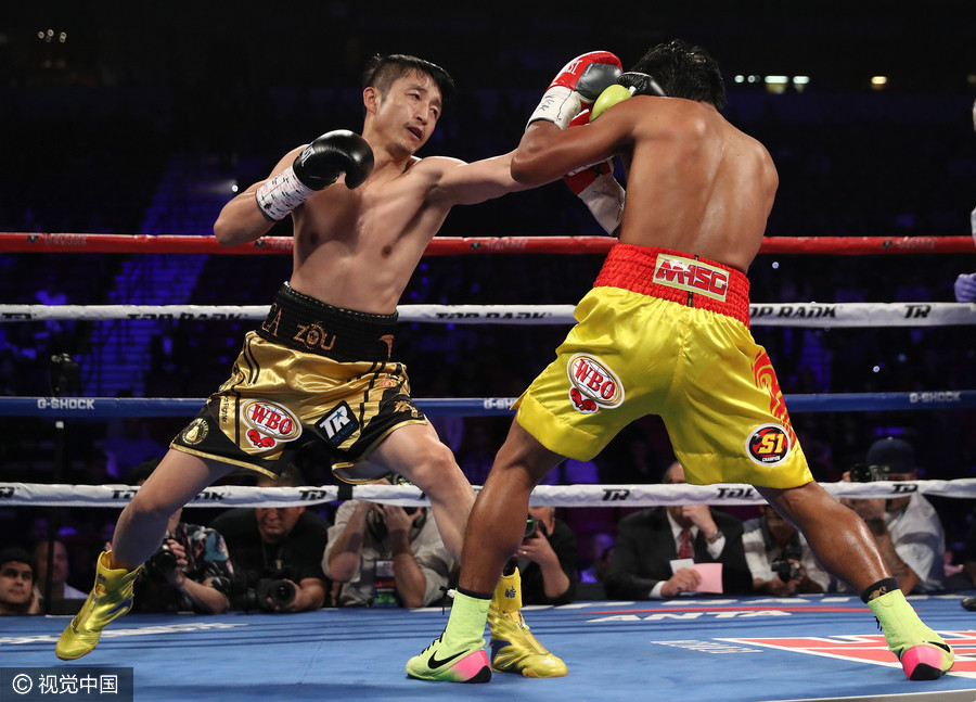 Zou Shiming secures first gold at WBO flyweight championship