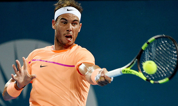 Nadal cruises, net-focused Raonic slugs it out in Brisbane