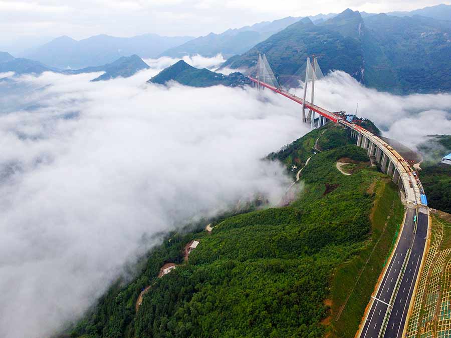 Main span of highest bridge completed in SW China