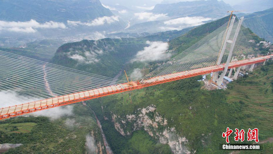 Main span of highest bridge completed in SW China